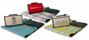 Picnic blanket from Kanata Blanket Co. lets you add your company logo. With two cover colors to choose from and three plaid interiors, you can have any of six beautiful combinations. The blanket is easy to carry and store and folds into a convenient cover with carry handle and Velcro closures.  Item EPICMIX.